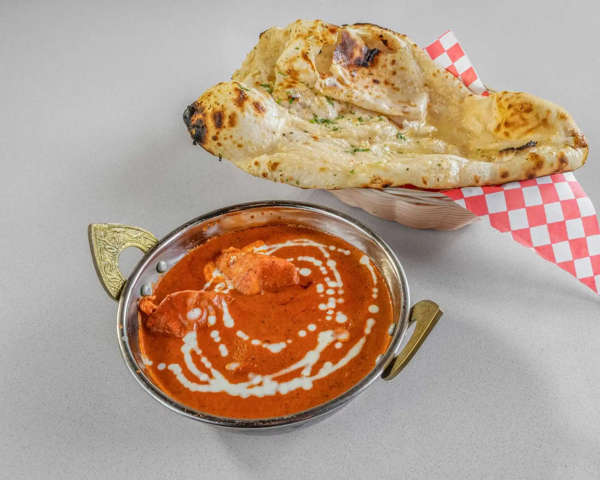 Butter Chicken - Signature creamy tomato curry at Om Cuisine of India Calgary